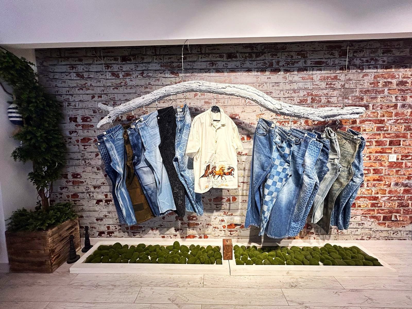 Samples hung from the branch rail against the brick wall in Rinato's showroom
